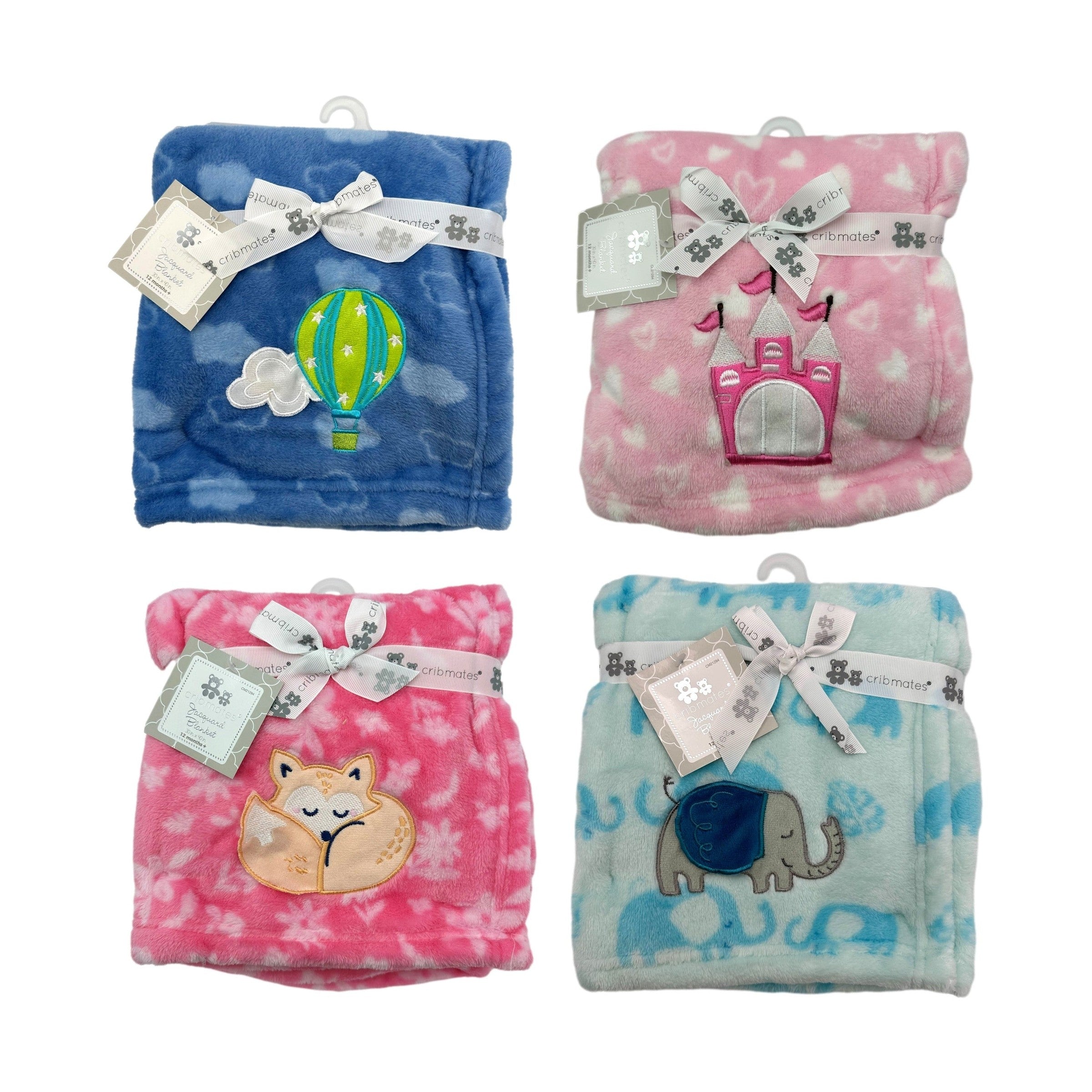 Four baby blankets are displayed against a white background. The blankets are folded and feature different colors and embroidered designs. From top left to bottom right: a blue blanket with a hot air balloon, a pink blanket with a castle, a pink blanket with a sleeping fox, and a light blue blanket with elephants. Each blanket is wrapped with a white ribbon that reads "cribmates," and a tag hangs from the ribbon.